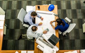 Adults together to plan a building layout