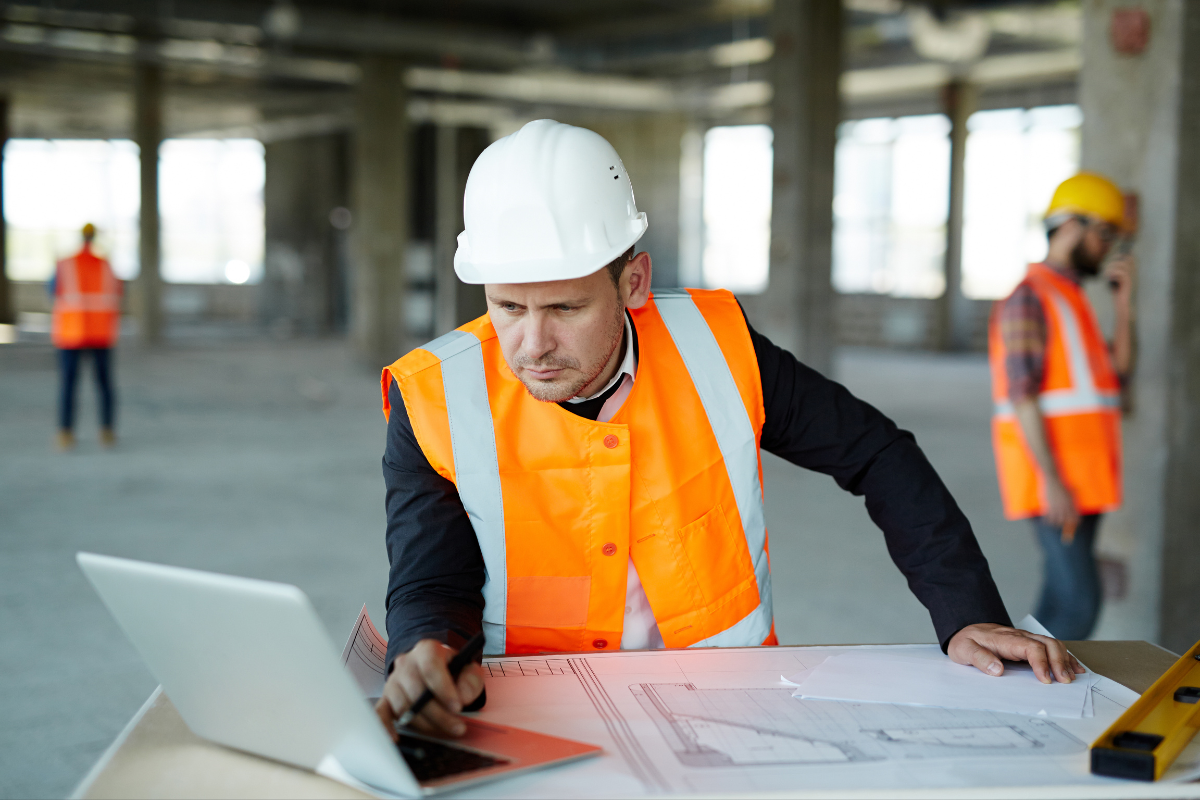 Maintenance worker using CMMS software