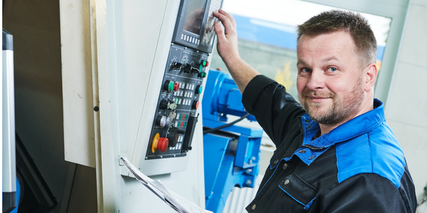 Man performing preventive maintenance on industrial equipment